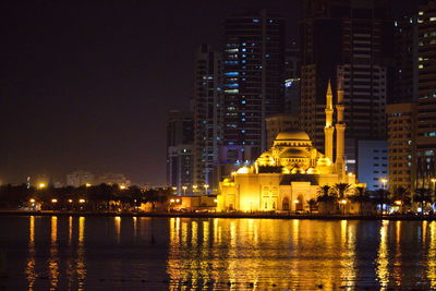 Illuminated buildings at waterfront