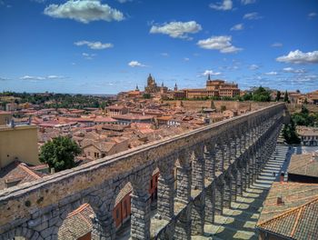 The famous ancient aqueduct of segovia with the cathedral in the background, castilla y león, spain