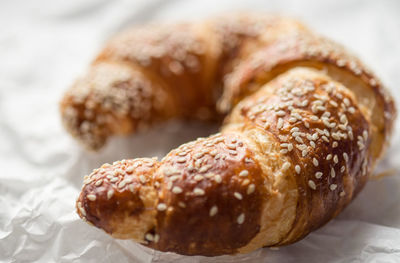 Close-up of croissant on paper