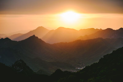 Scenic view of mountains against sky during sunset