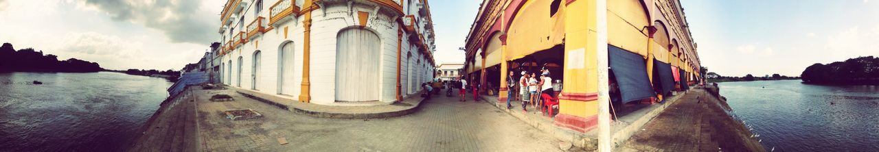 architecture, built structure, sky, building exterior, water, transportation, panoramic, the way forward, incidental people, cloud - sky, cloud, sea, travel, outdoors, mode of transport, street, road, travel destinations, day, car