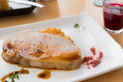 Close-up of beef steak in plate on table