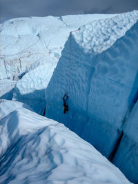 High angle view of person ice climbing