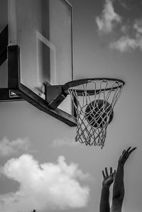 Low angle view of basketball hoop against sky