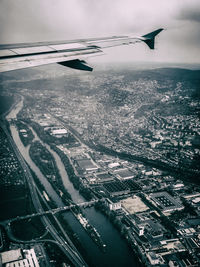 Aerial view of cityscape seen through airplane window