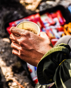 Close-up of hand holding ice cream