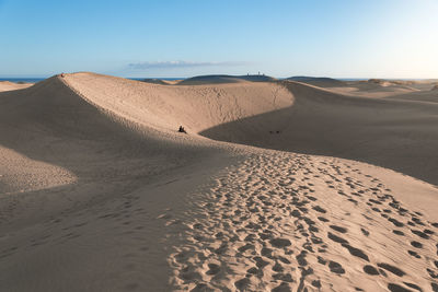 Scenic view of desert against clear sky