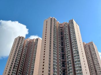 Low angle view of modern buildings against clear blue sky