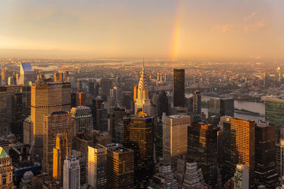 Aerial view of city buildings during sunset