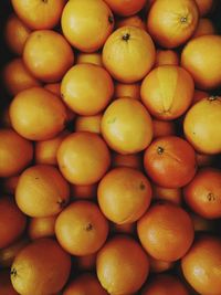 High angle view of oranges in market for sale