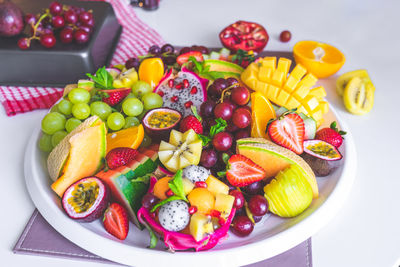 High angle view of fruits in plate on table