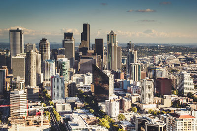 High angle view of modern buildings in city against sky