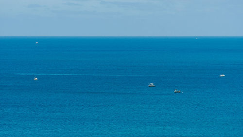 Scenic view of blue sea against sky