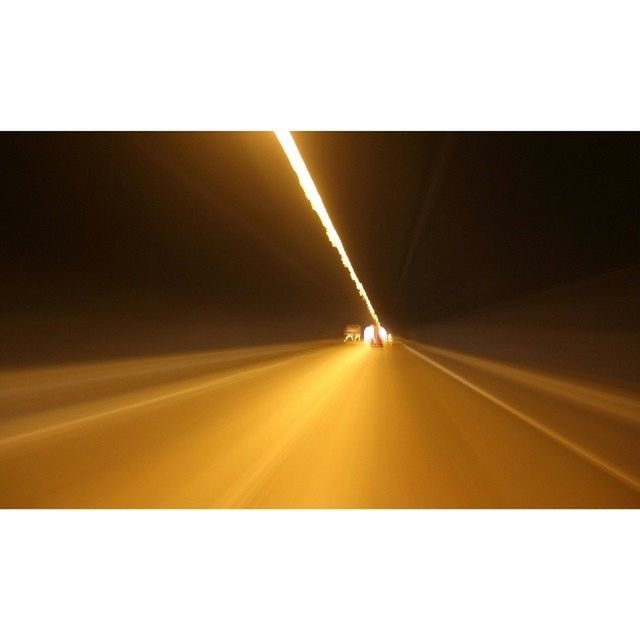 transfer print, auto post production filter, transportation, the way forward, diminishing perspective, road marking, road, vanishing point, illuminated, copy space, tunnel, no people, empty, indoors, sky, blurred motion, street, motion, travel