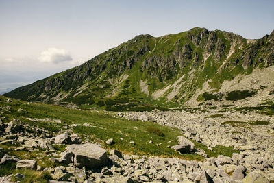 Scenic view of landscape and mountains against sky