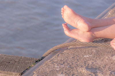 Low section of person against sky