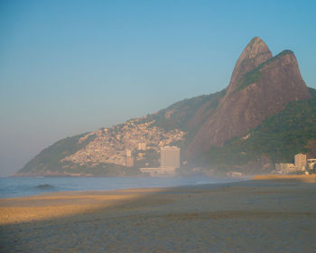 Scenic view of calm sea against clear sky