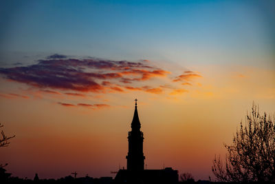 Silhouette of church against sky during sunset