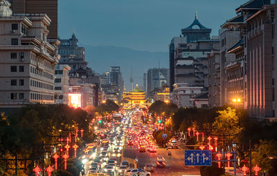 Illuminated buildings in city at night