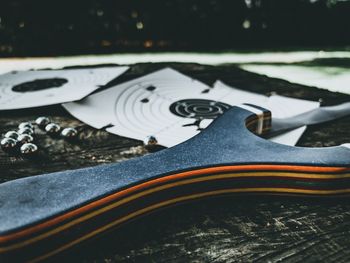 Close-up of metallic object on wood