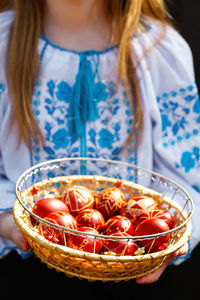 Midsection of woman holding food