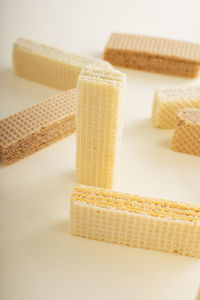 Close-up of bread on table against white background