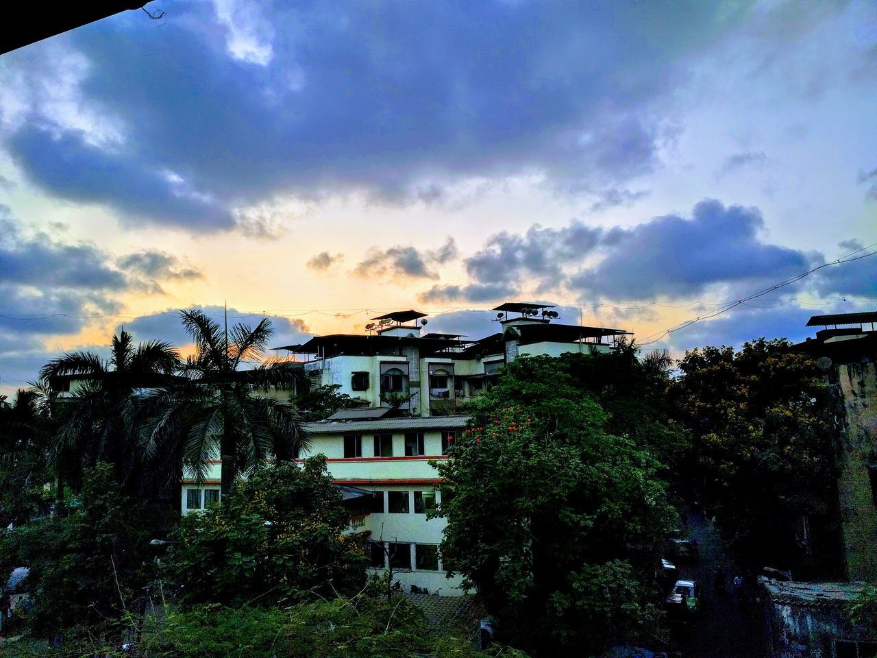 HOUSES AND TREES AGAINST SKY