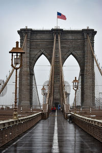 Brooklyn bridge in lower manhattan is seen on a foggy day, march 17, 2022 in new york city.