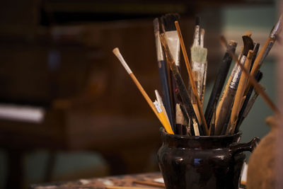 Close-up of paintbrushes on table