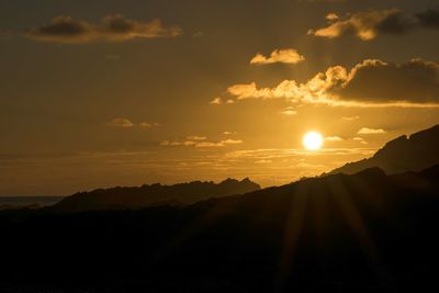 Scenic view of sunset over mountain