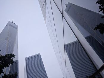 Low angle view of modern buildings against clear sky