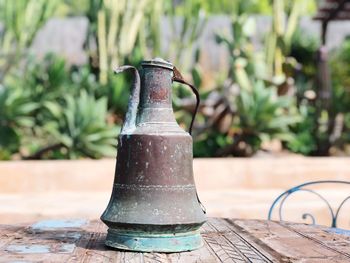 Close-up of metallic container on table