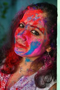 Young girl celebrating festival of colours holi. 
