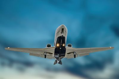 Airplane flying against sky