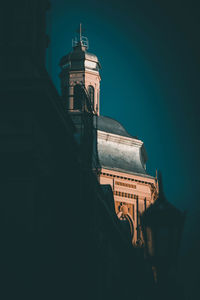 Low angle view of historic building against sky at night