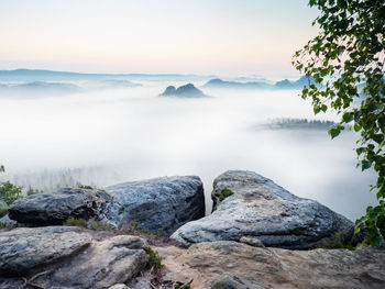 Scenic view of rocks in mountains against sky