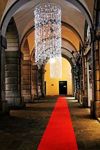 Illuminated corridor of historic building