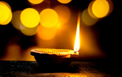 Close-up of illuminated lamp against blurred background