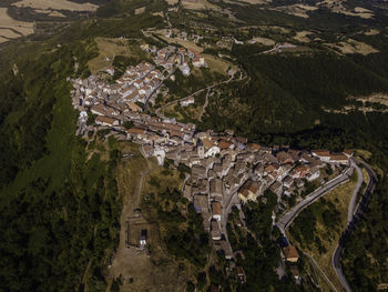 High angle view of road amidst trees and landscape