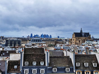 Buildings in city against sky