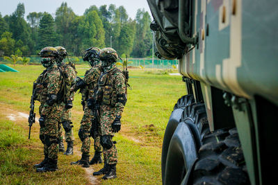 Army soldiers standing on field