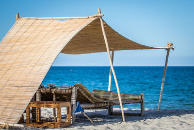 Camp beds on beach