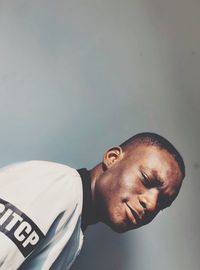 Portrait of young man looking away