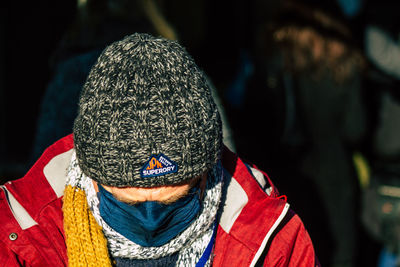 Close-up portrait of person wearing hat