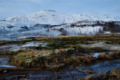 Scenic view of frozen lake against sky