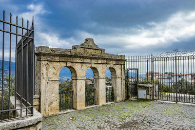 Low angle view of historical building against cloudy sky