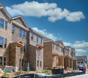 Low angle view of buildings against blue sky