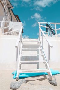 View of stairs against blue sky
