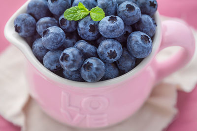 Close-up of blueberries in mug