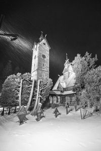 Low angle view of temple against sky during winter